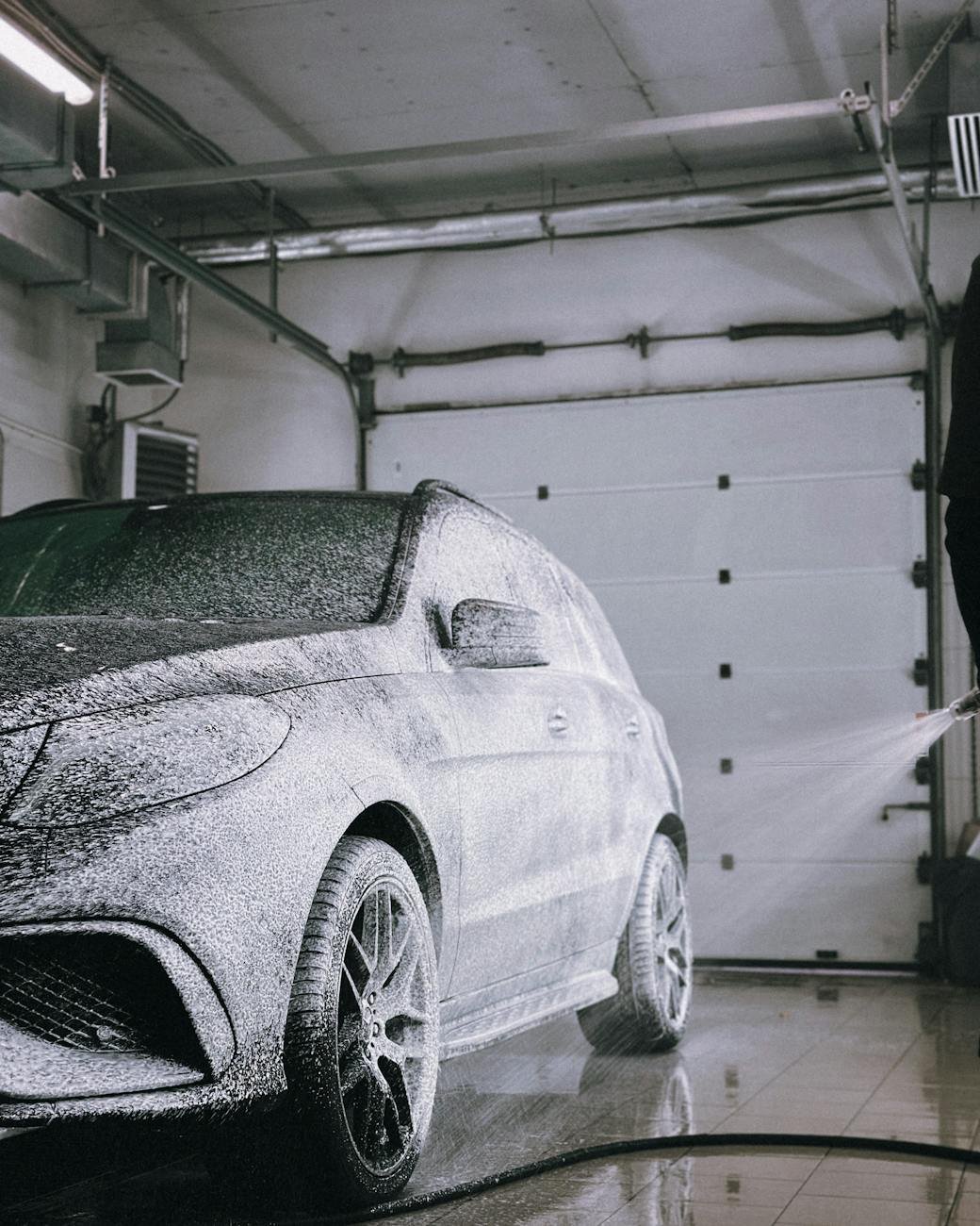 luxury car being washed in garage