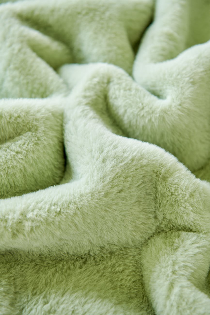 soft green fabric texture in close up view