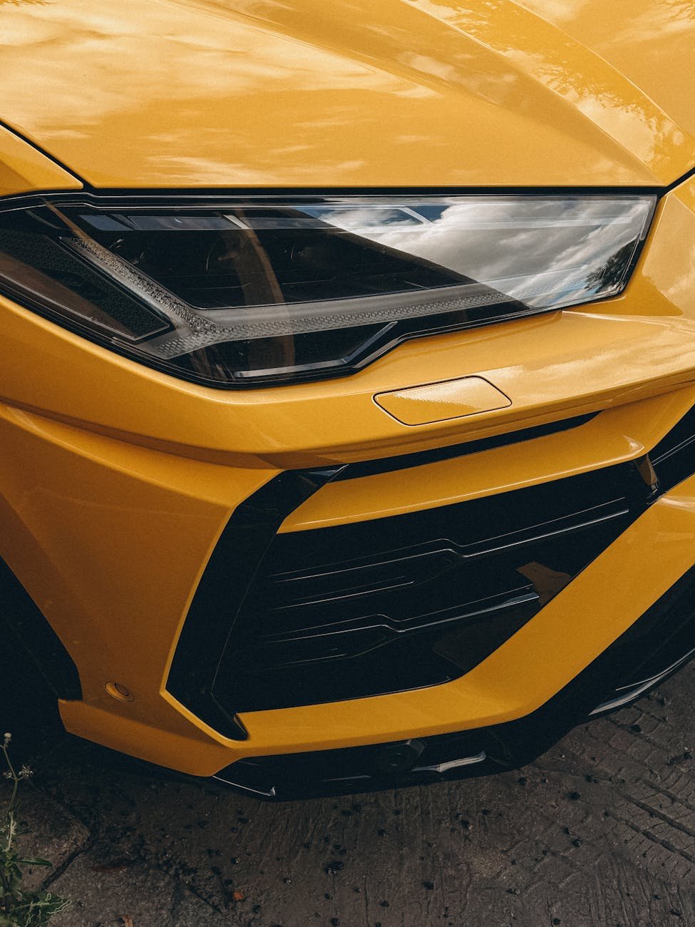 close up of a yellow sports car front