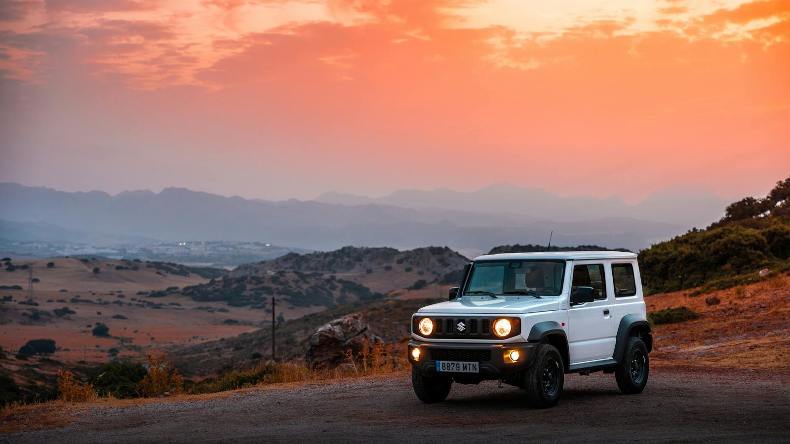 compact suv in scenic sunset landscape