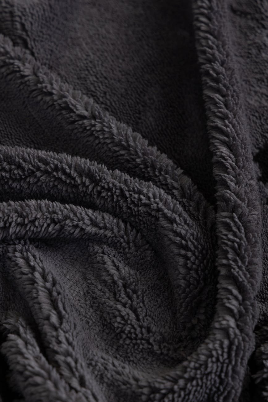 cozy soft black plush blanket texture close up