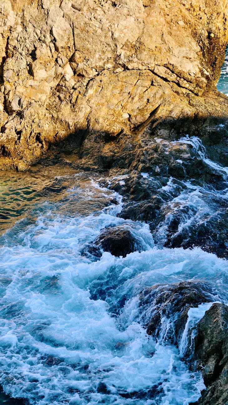 dramatic coastal waves and rocky cliffs