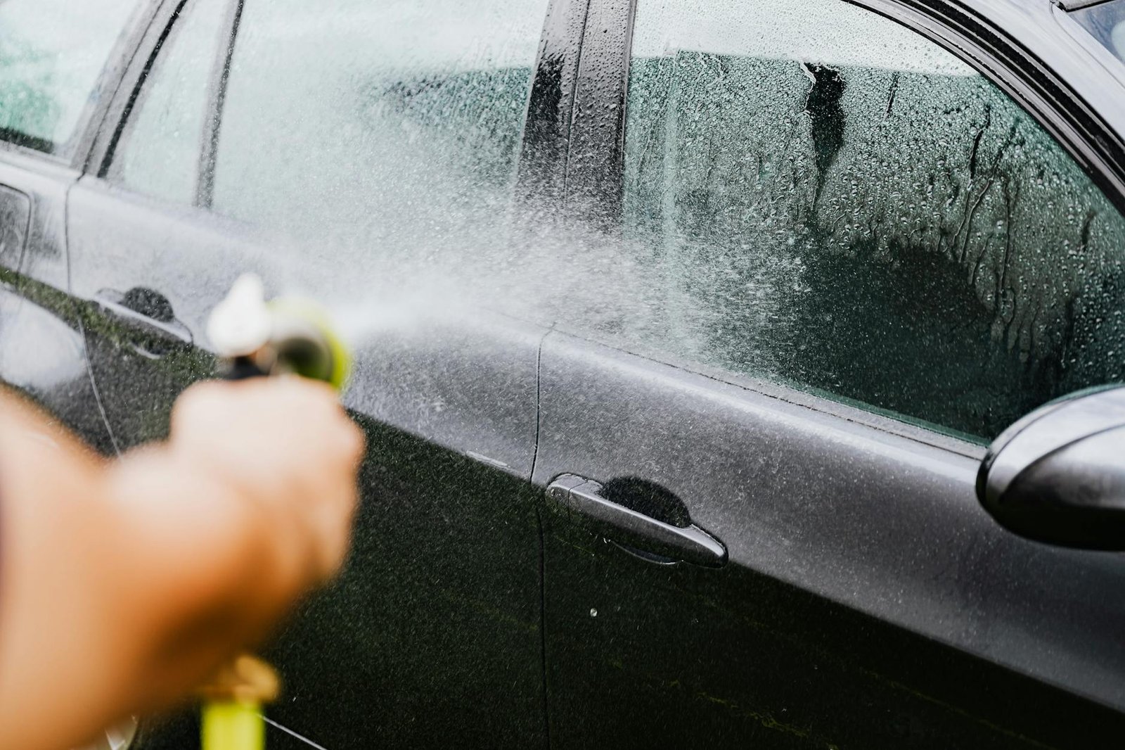 a person washing a car