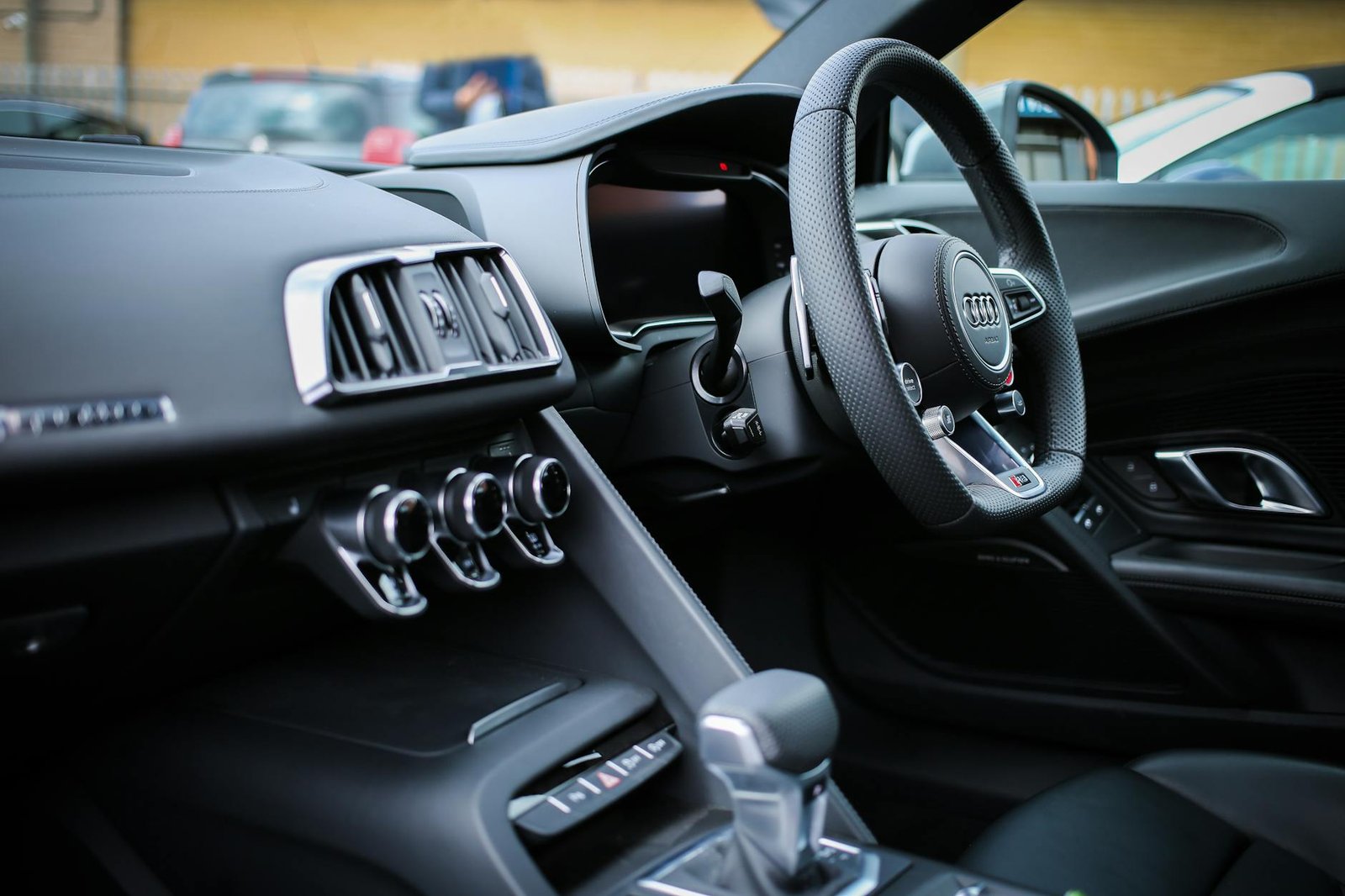 photo of black steering wheel